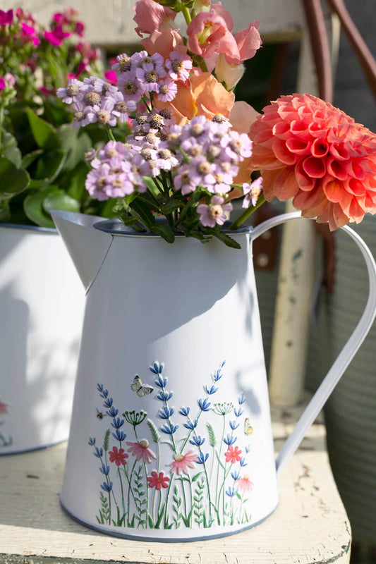 WHITE METAL PITCHER WITH FLORAL EMBOSS
